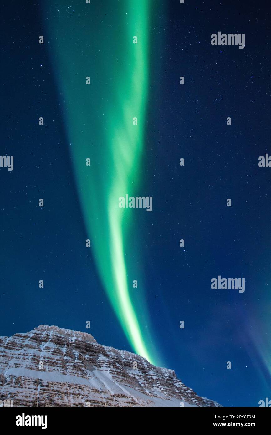 Northern lights over snowy peak landscape photo Stock Photo Alamy