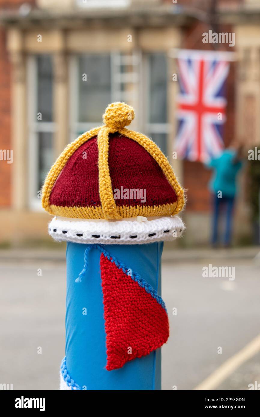 The traffic bollards in Alford Market Square are covered in knitted