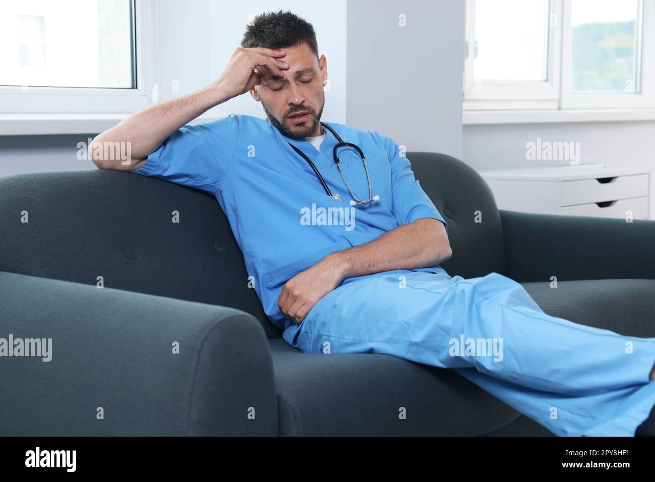 Exhausted doctor sleeping workplace hi-res stock photography and images ...