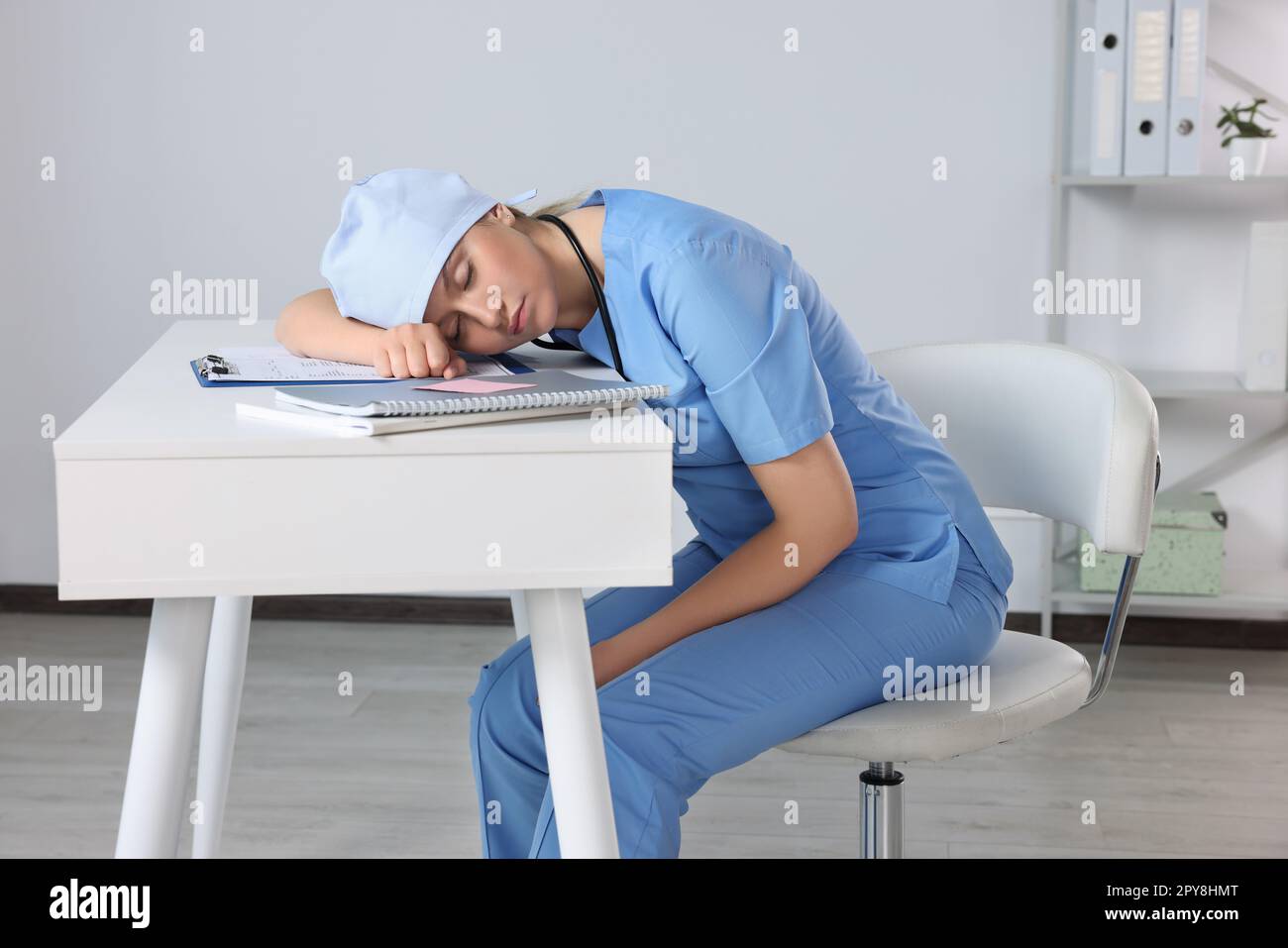 Exhausted doctor sleeping workplace hi-res stock photography and images ...