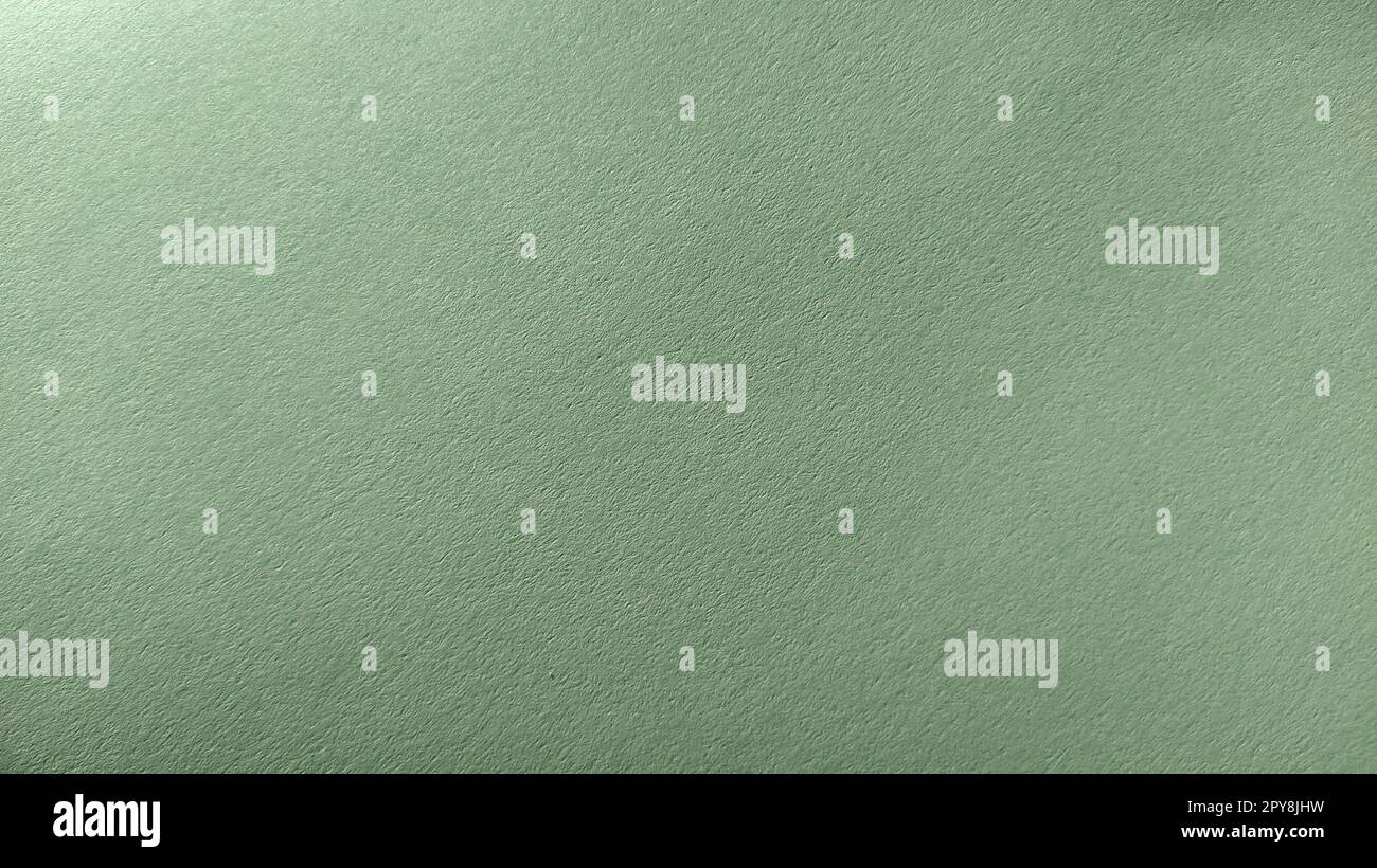 A sheet of light green paper with vignetting at the bottom. Calm green with fine paper texture. Soothing interior color Stock Photo