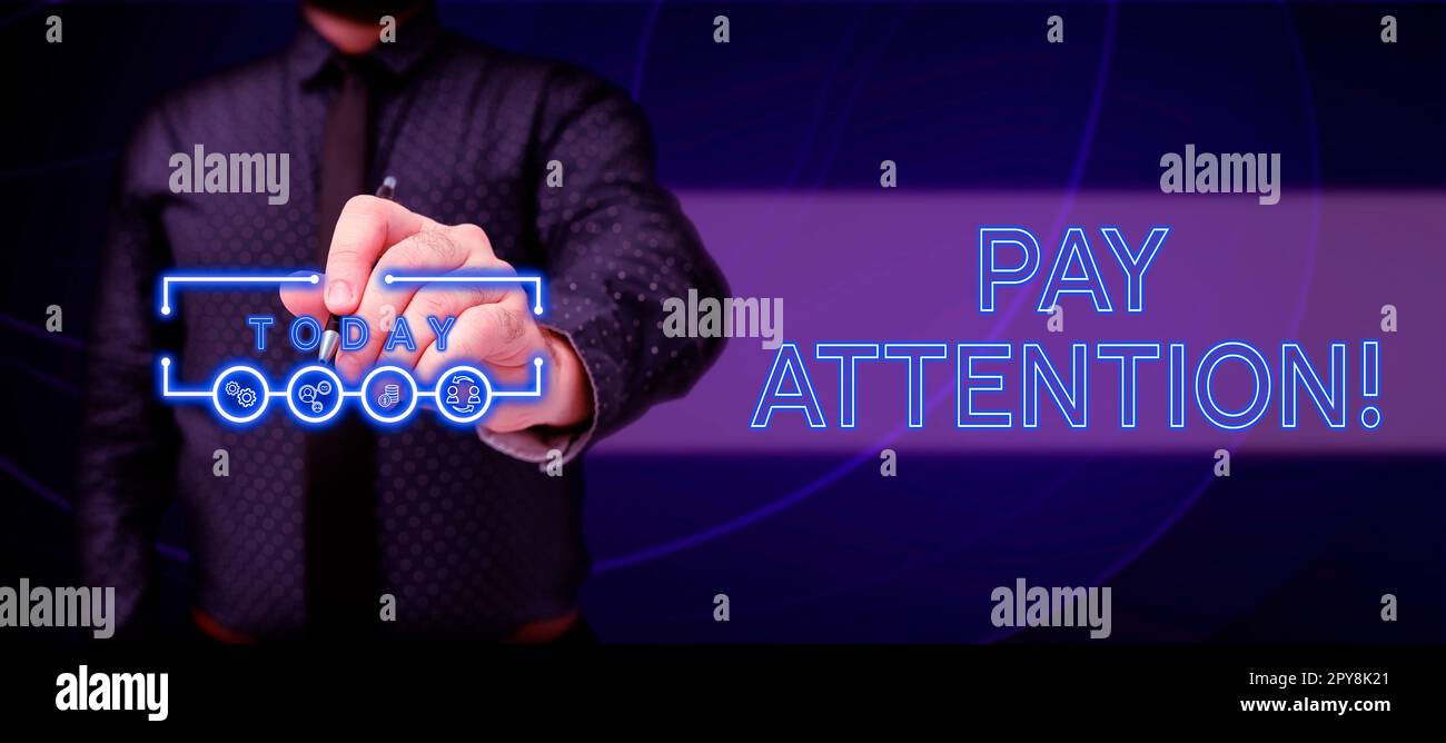 Sign displaying Pay Attention, Word Written on take notice of someone