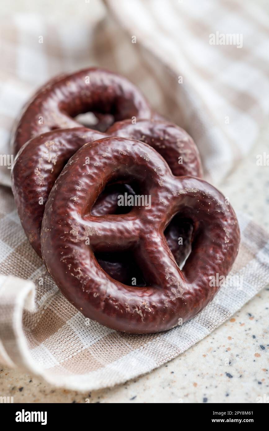 Sweet chocolate pretzels on checkered napkin. Stock Photo