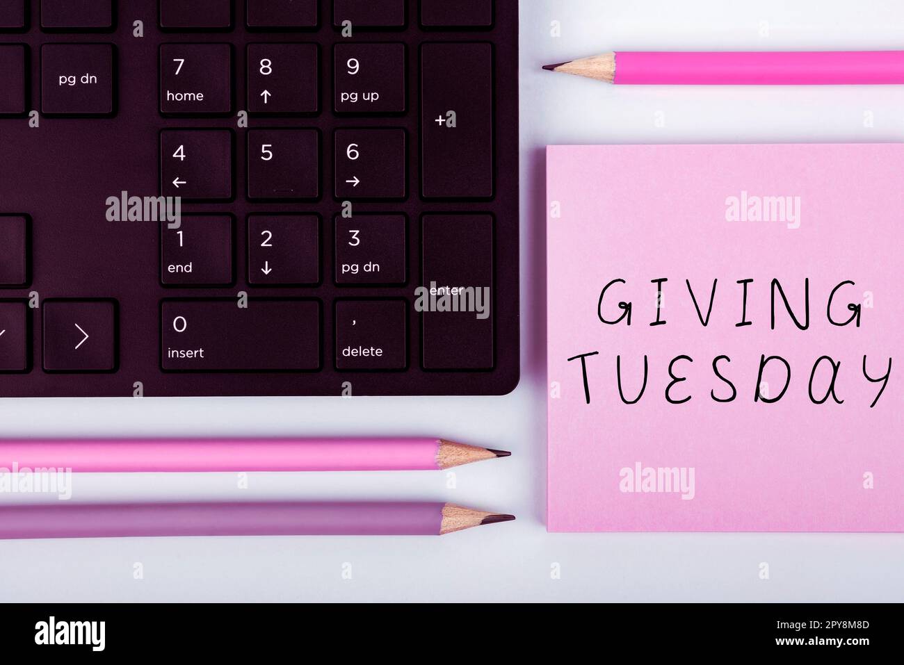Hand writing sign Giving Tuesday. Business idea international day of charitable giving Hashtag activism Stock Photo