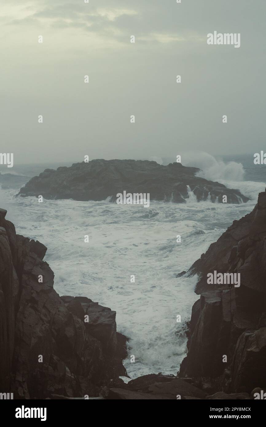 Foamy waves between cliffs landscape photo Stock Photo