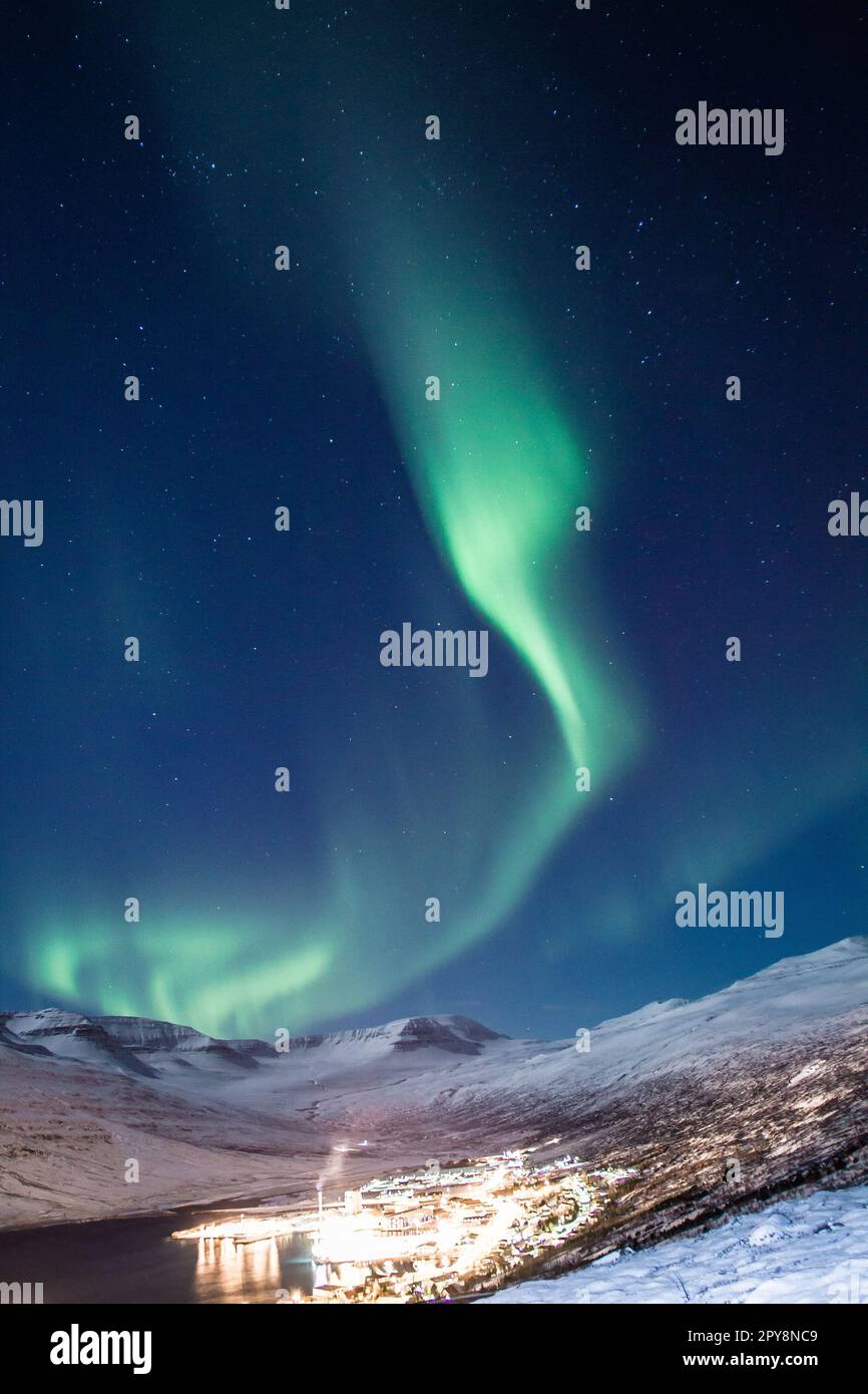Aurora borealis over night village landscape photo Stock Photo
