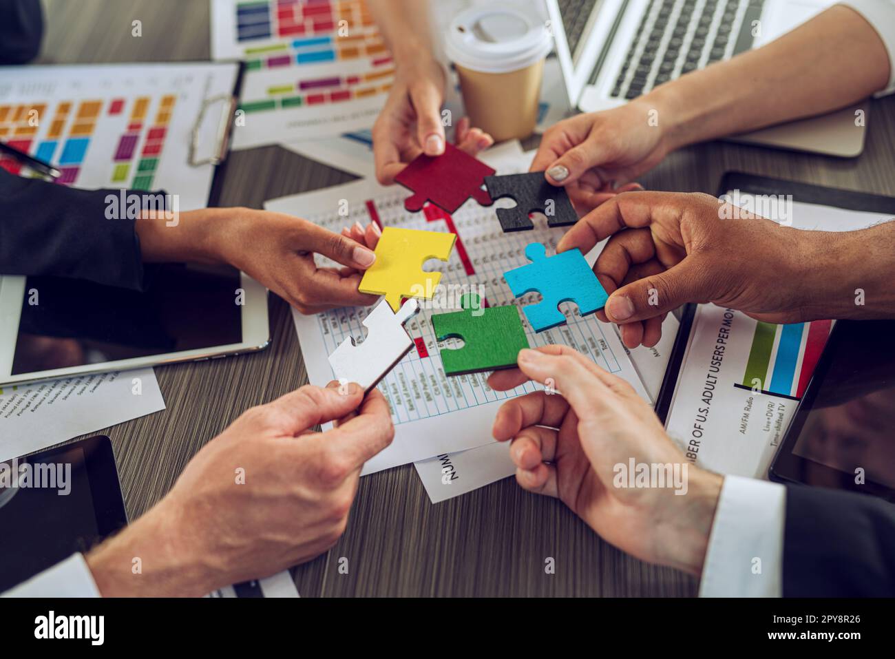 Teamwork of partners. Concept of integration and startup with puzzle pieces Stock Photo
