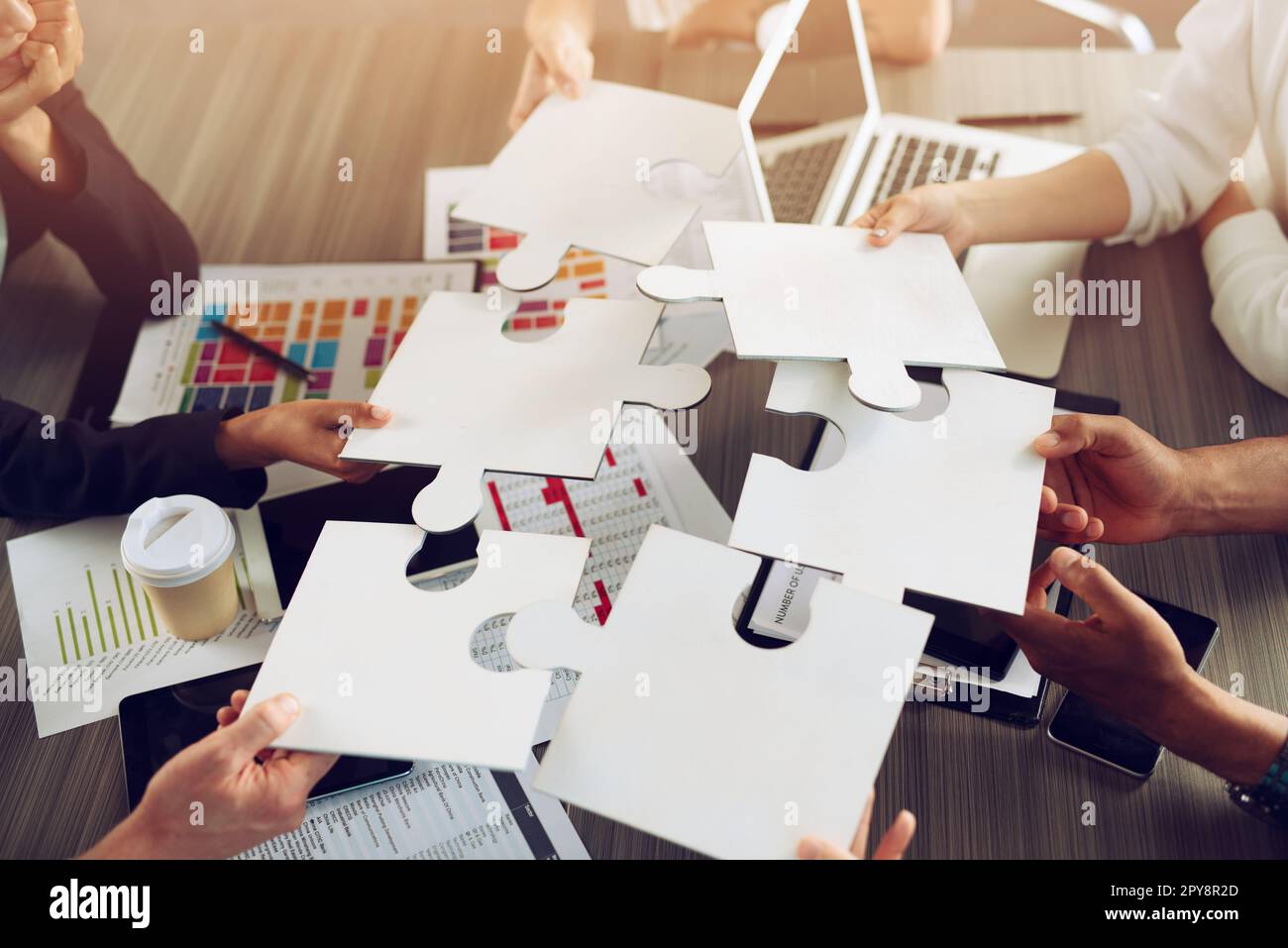 Teamwork of partners. Concept of integration and startup with puzzle pieces Stock Photo