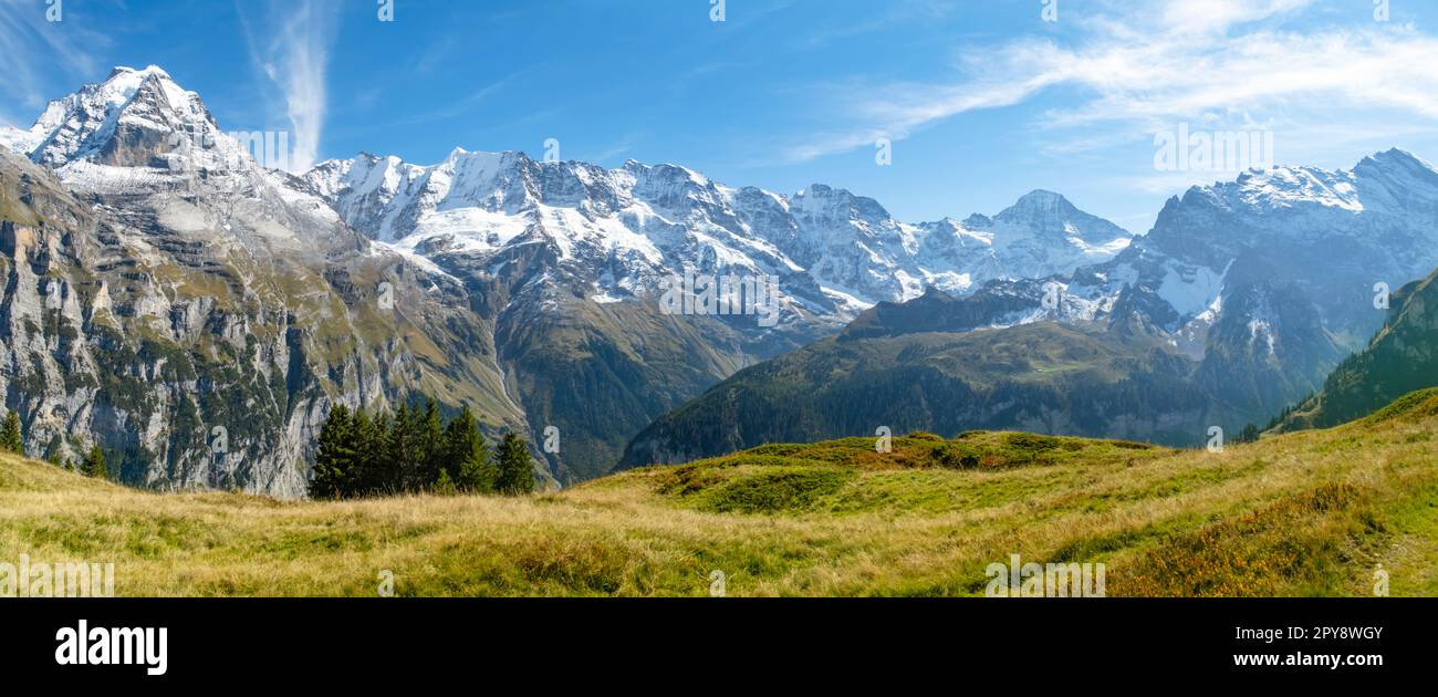 Traditional alpine village in touristic valley Lauterbrunnen ...