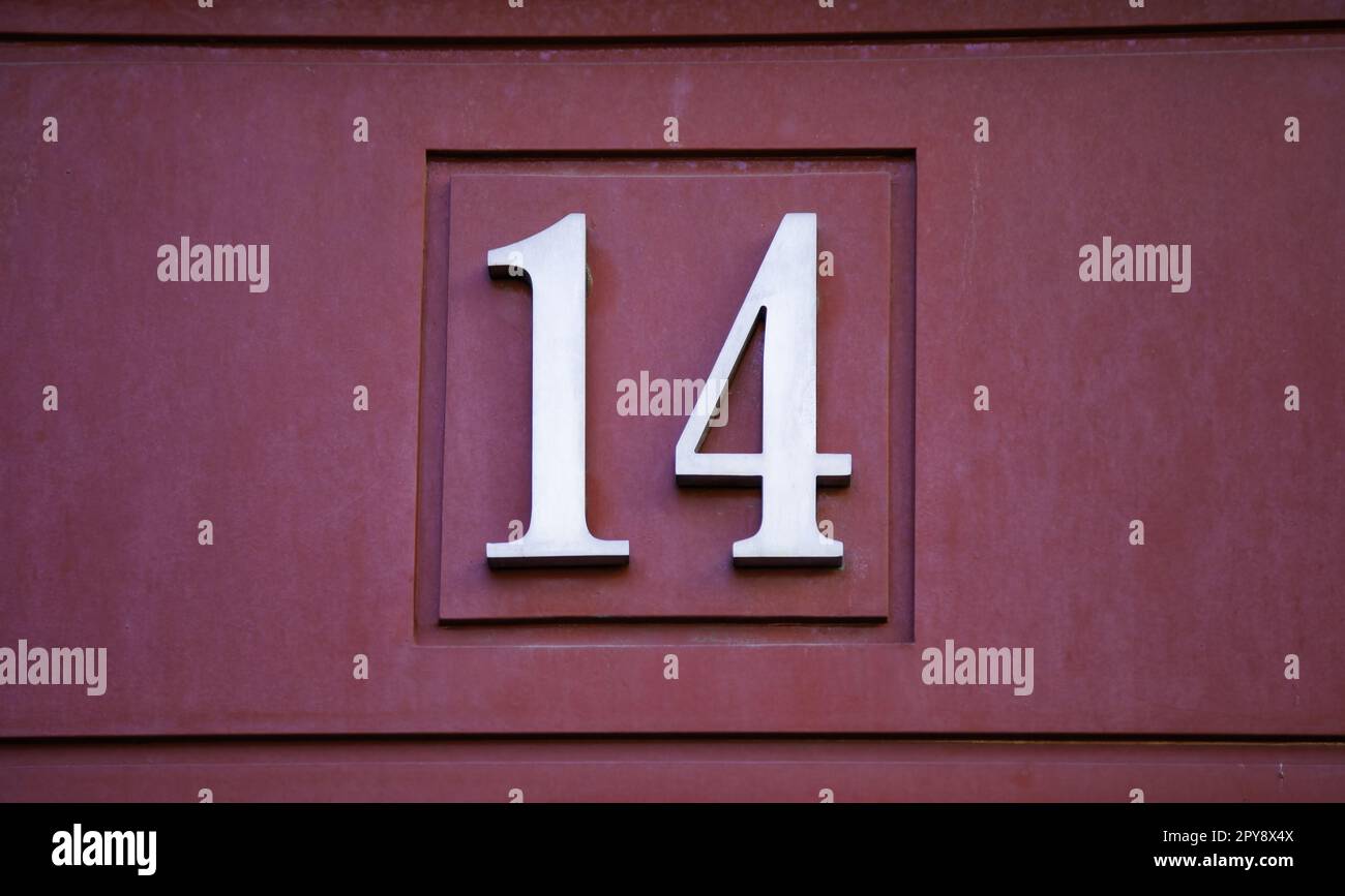 Number fourteen on a wall Stock Photo