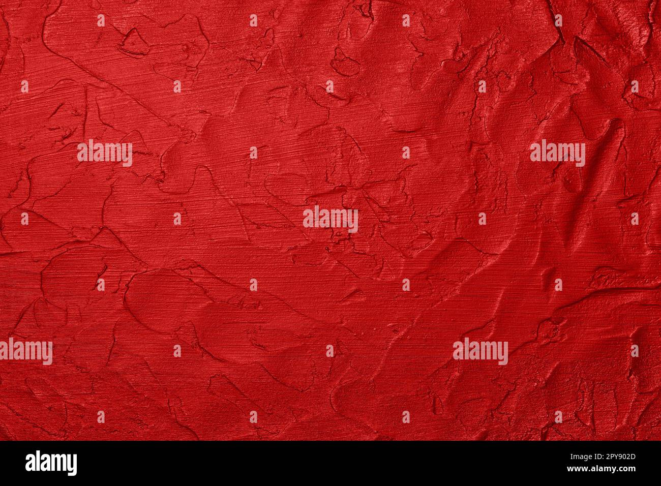 Red uneven grunge surface abstract background Stock Photo