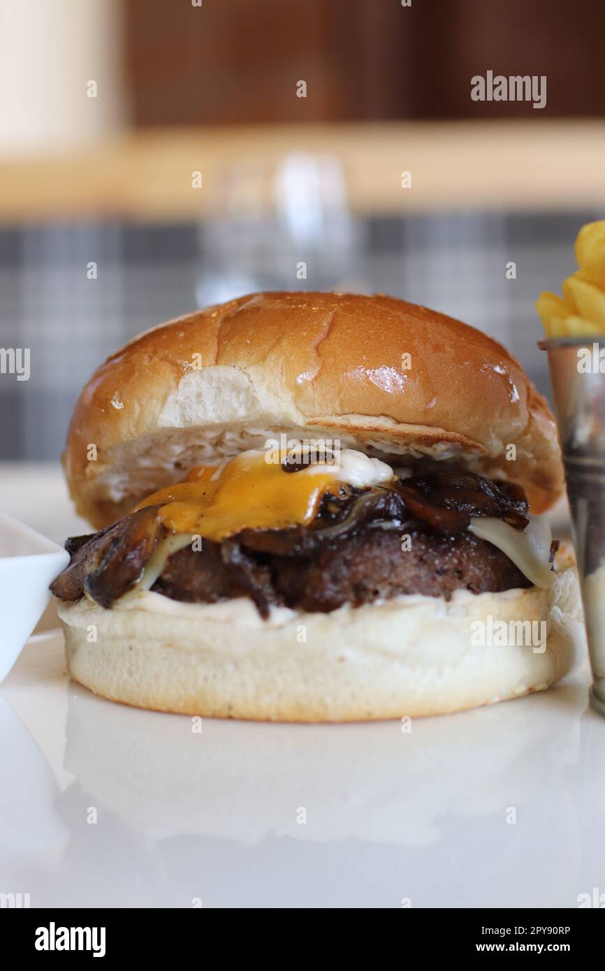 A Delicious-looking Burger Featuring A Beef Patty, Melted Cheese ...