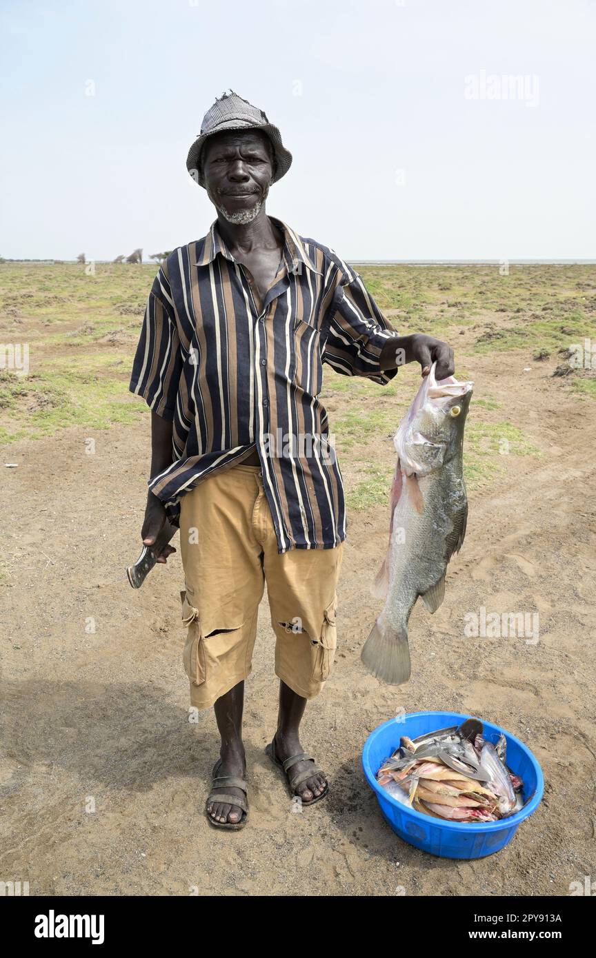 KENYA, Turkana, village Anam at Lake Turkana, fisherman with Nile perch / KENIA, Turkana, Dorf Anam am Lake Turkana, Fischer Stock Photo