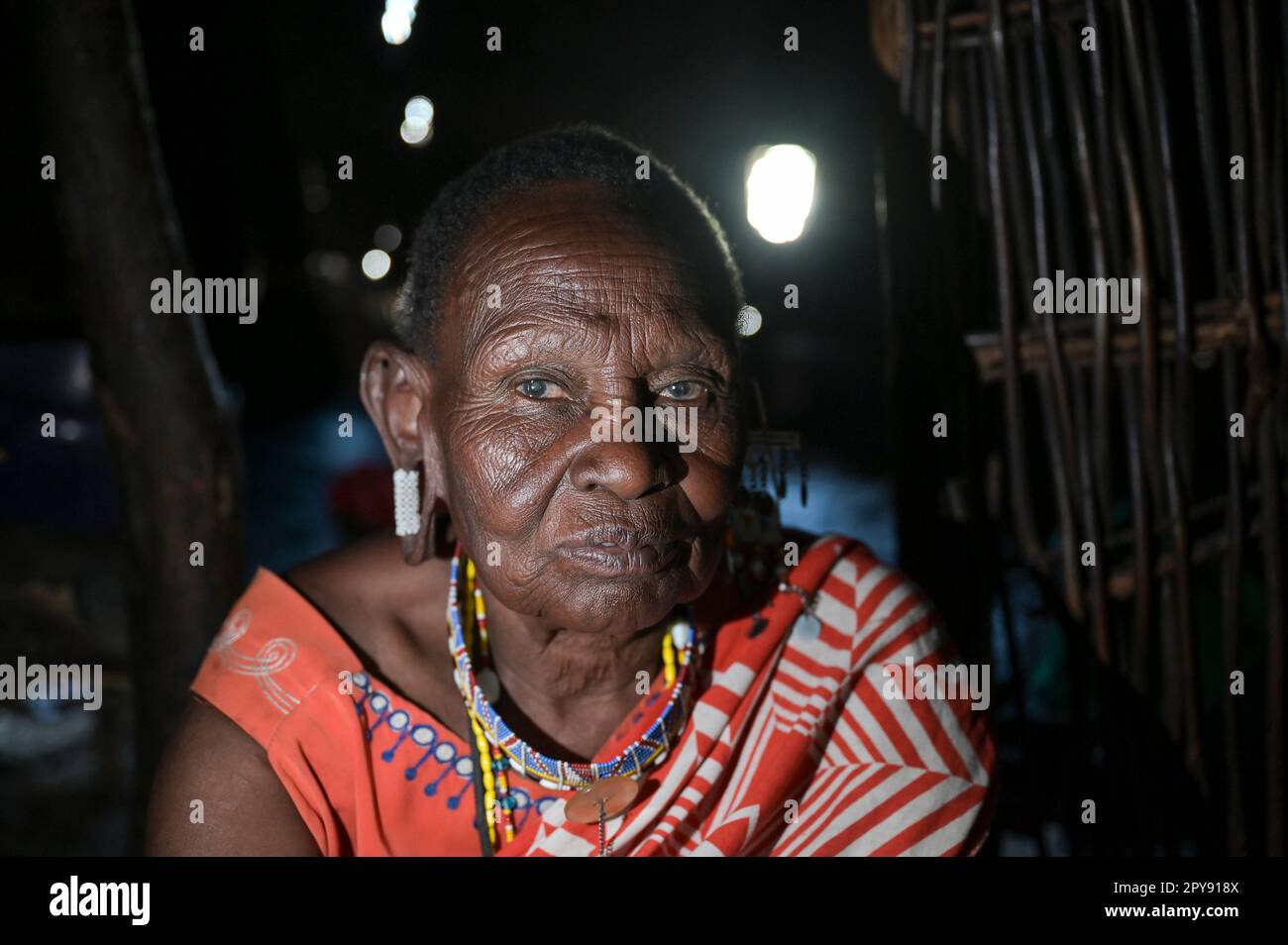 KENYA, Kajiado, Massai villages near town Mile 46, Massai pastoral tribe practise  FGM, female genital mutilation, old woman circumciser in her hut, impressive face Stock Photo