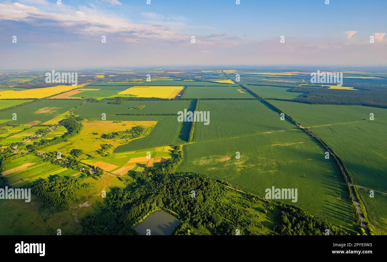 Top view drone shot of a green field and river Stock Photo - Alamy
