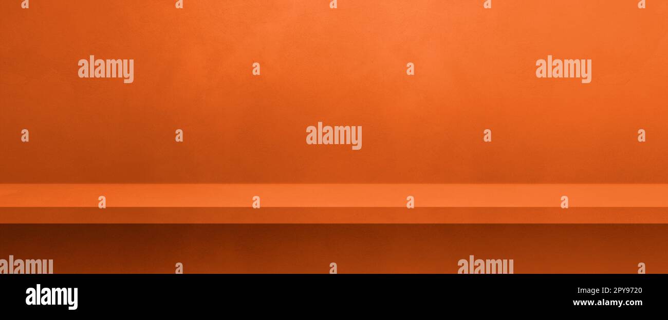 Empty shelf on a neon orange concrete wall. Background template