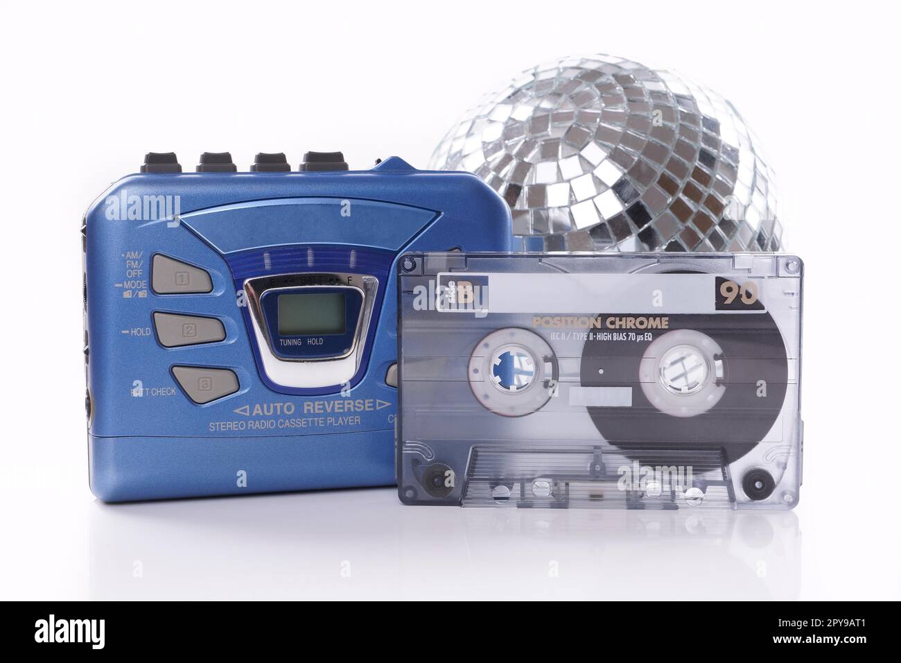 old-fashioned music cassette, walkman player and disco ball Stock Photo