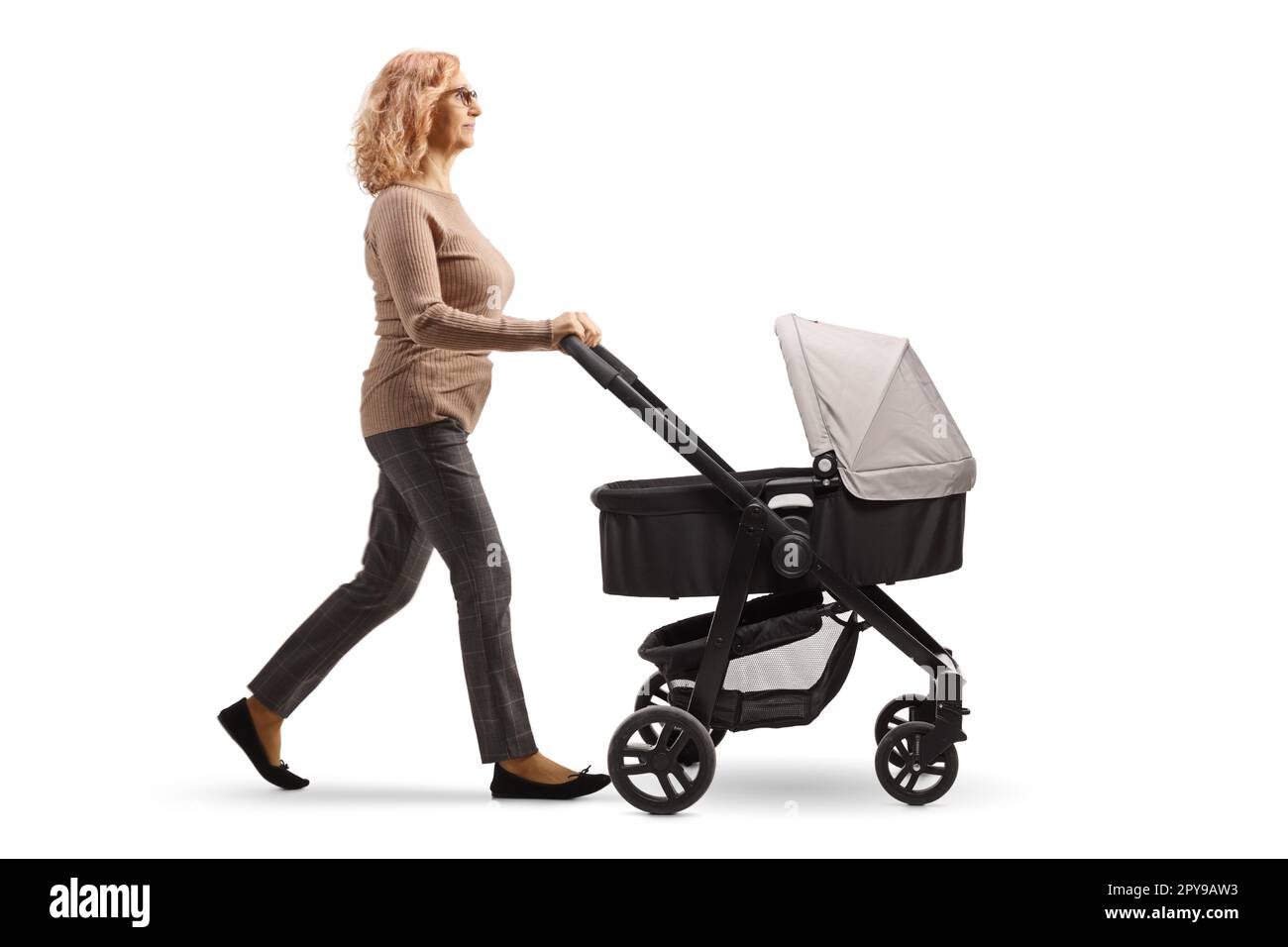 Full length shot of a mature woman pushing a baby stroller isolated on white background Stock Photo
