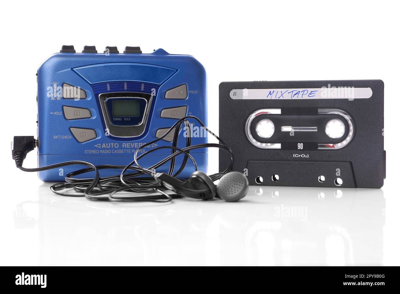old-fashioned music cassette and walkman player with earphones Stock Photo