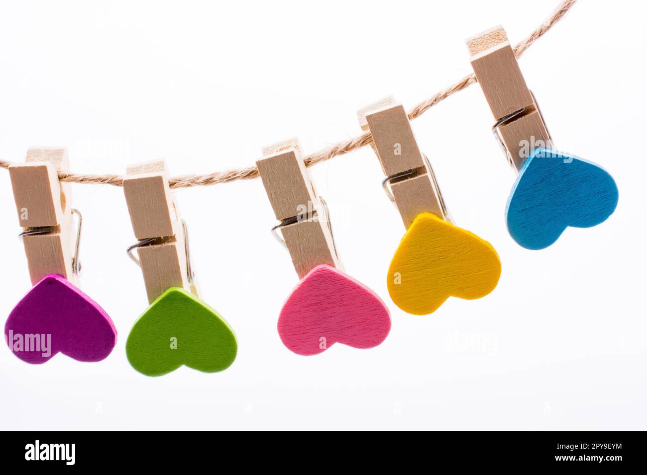 Hearted clips hanging on a thin rope Stock Photo - Alamy