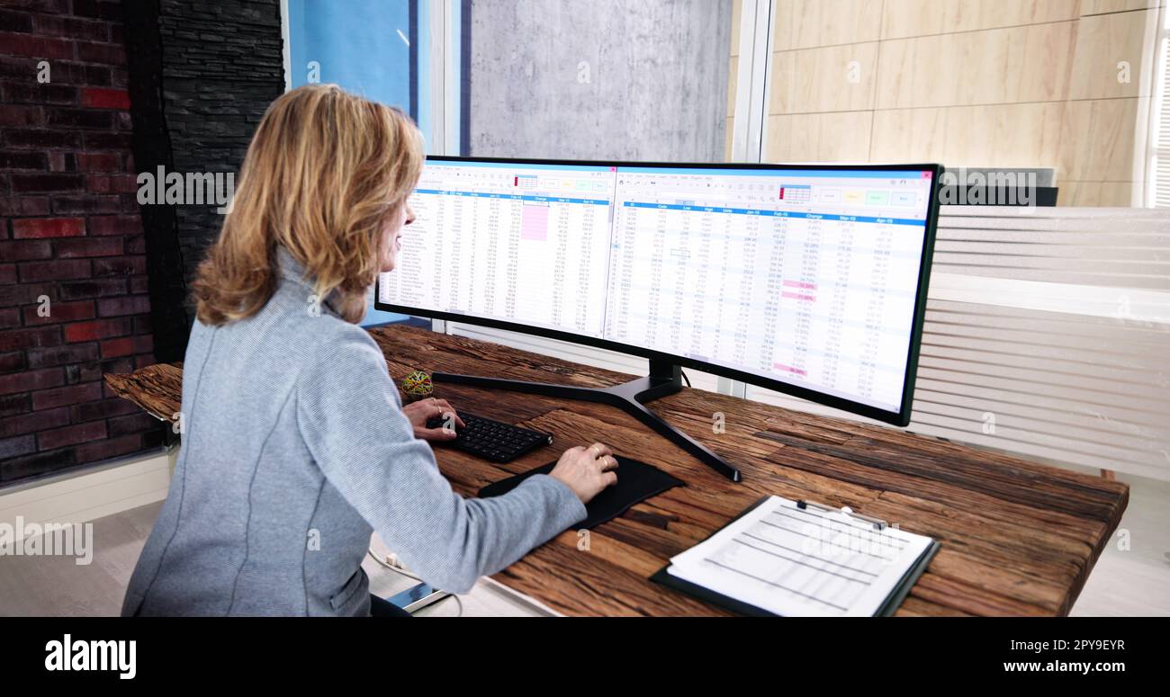 Data Analyst Woman Using Spreadsheet Stock Photo