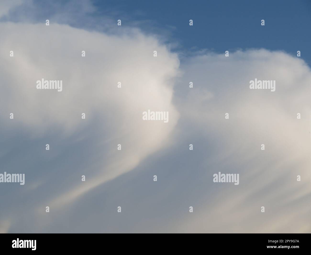 White clouds in a blue sky hi-res stock photography and images - Alamy