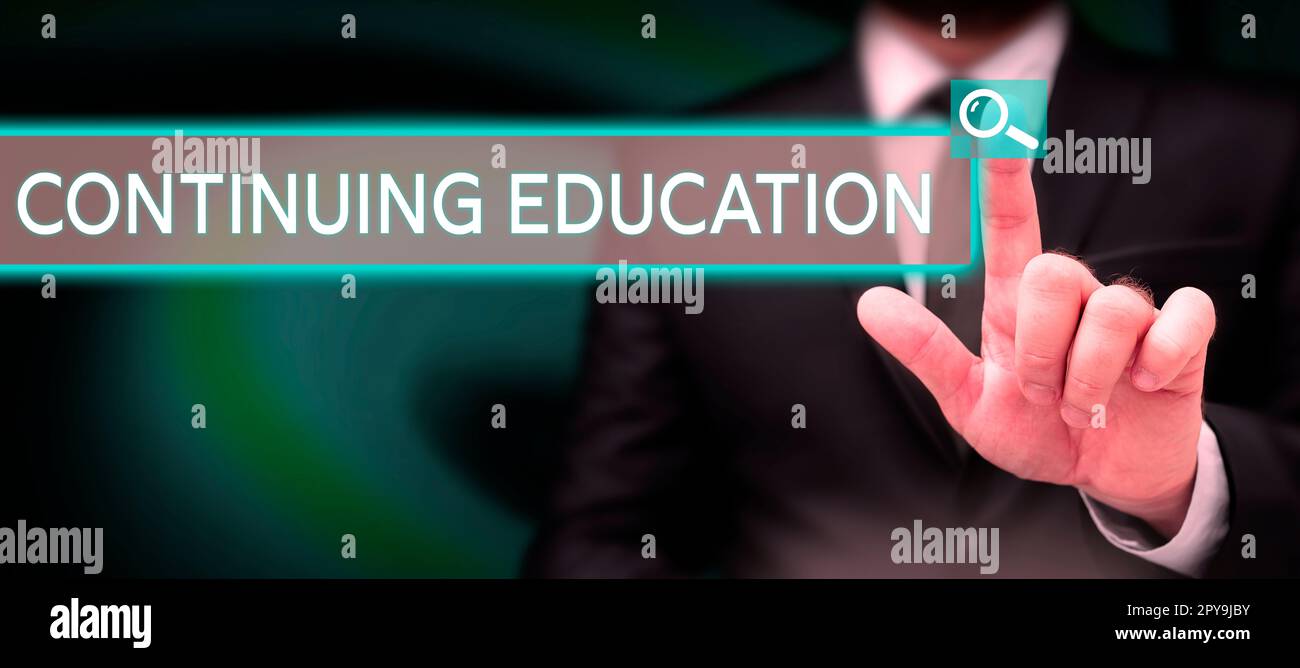 Hand writing sign Continuing Education. Business idea Continued ...
