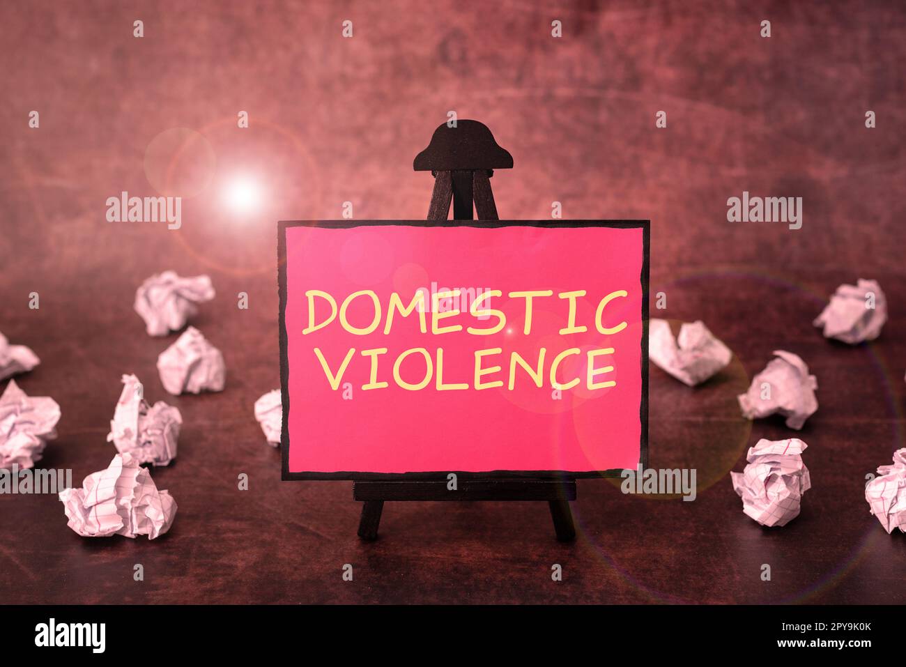 Sign displaying Domestic Violence. Word for violent or abusive behavior directed by one family or household member Stock Photo