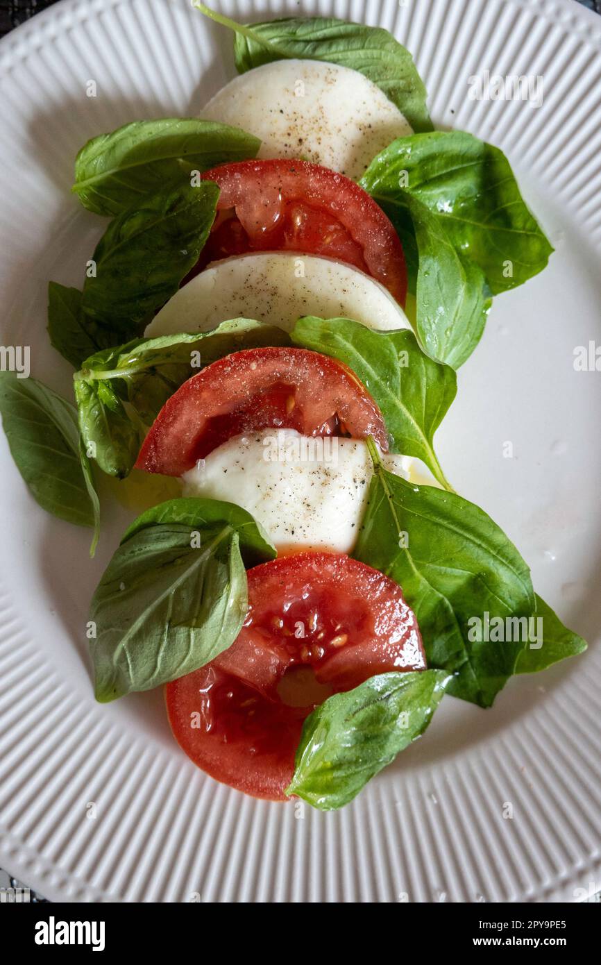 Tomato, Mozzarella Cheese and Basil salad Stock Photo