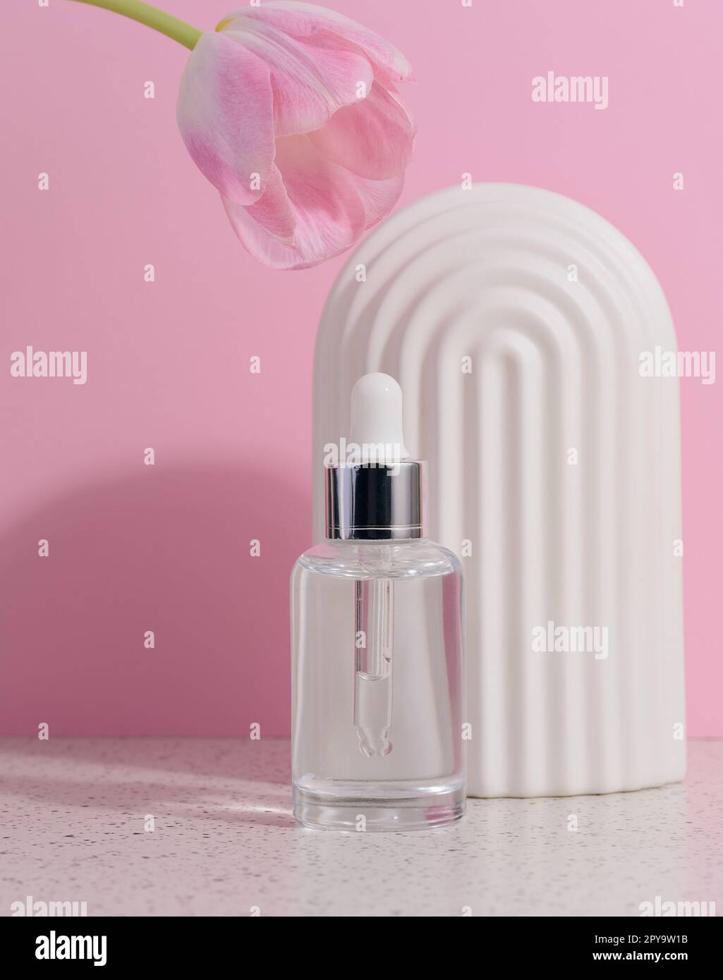 Clear glass dropper bottle with cosmetic product Stock Photo