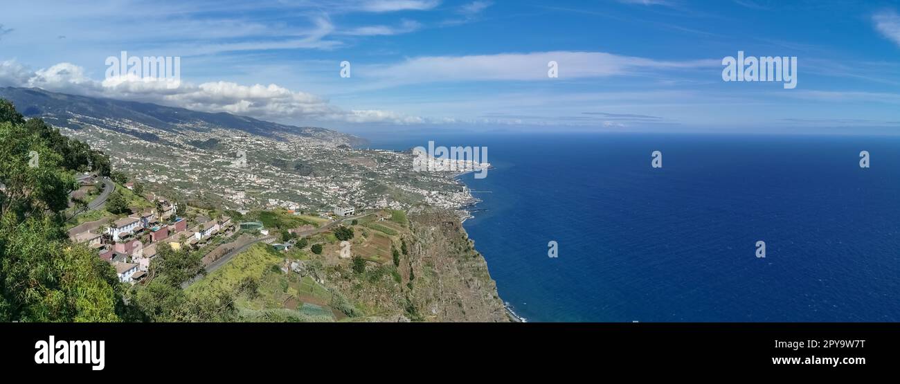 Madeira Island Portugal - 04 21 2023: Full panoramic aerial view of the city of Funchal and Camara de Lobos, tourist and iconic city on the island of Stock Photo