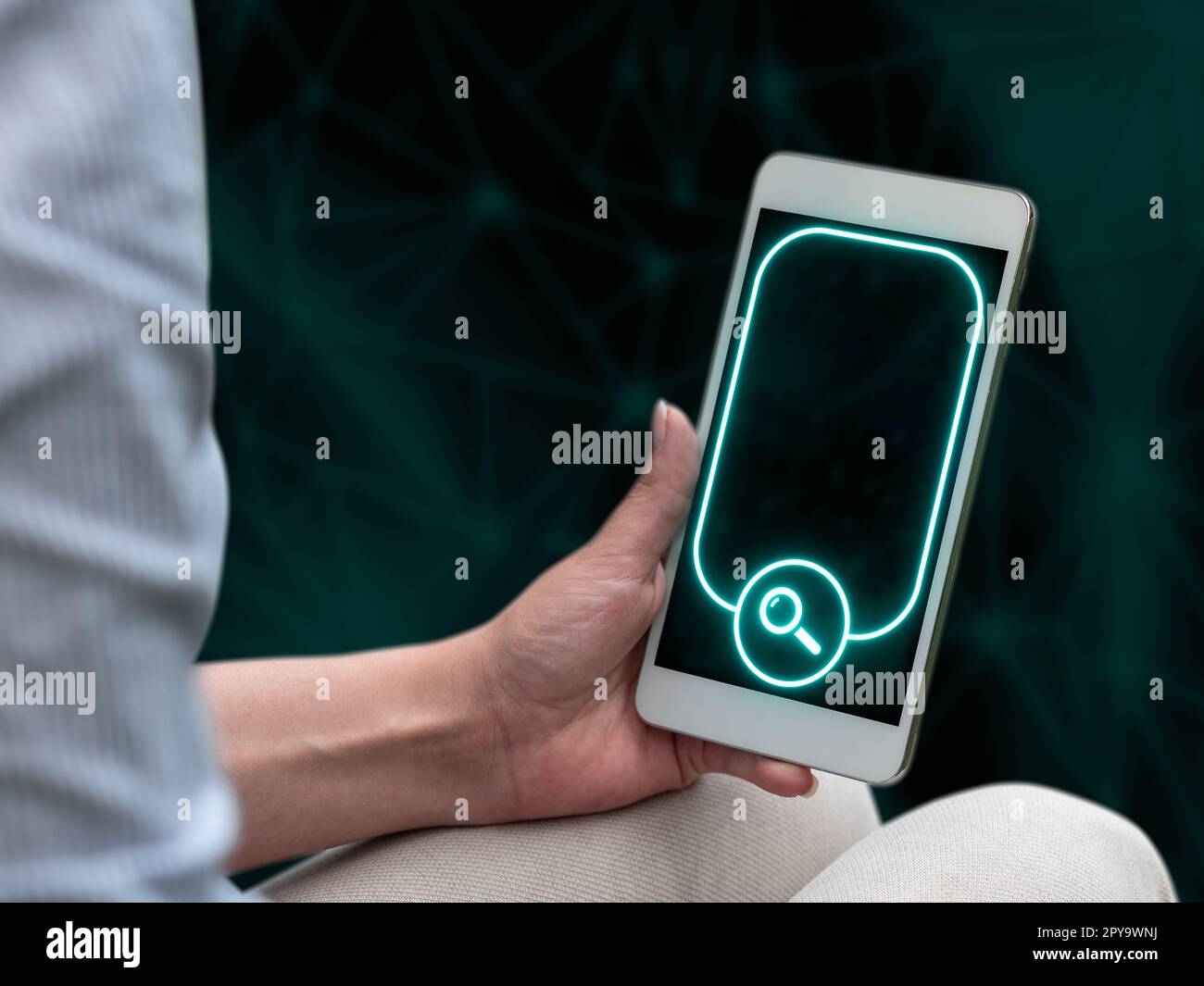 Person sitting and holding phone in one hand. Important information on the mobile phone display. Crllphone monitor glowing. Futuristic image with colored glow. Stock Photo