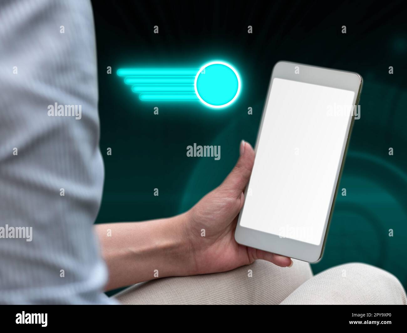 Person sitting and holding phone in one hand. Important information on the mobile phone display. Crllphone monitor glowing. Futuristic image with colored glow. Stock Photo