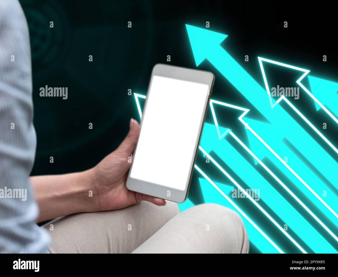 Person sitting and holding phone in one hand. Important information on the mobile phone display. Crllphone monitor glowing. Futuristic image with colored glow. Stock Photo