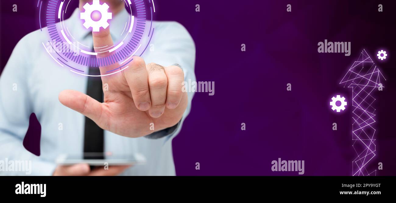 Businessman in office suit standing and holding mobile phone in hand. Man pressing virtual button with his finger. Futuristic style image with colored glow. Stock Photo