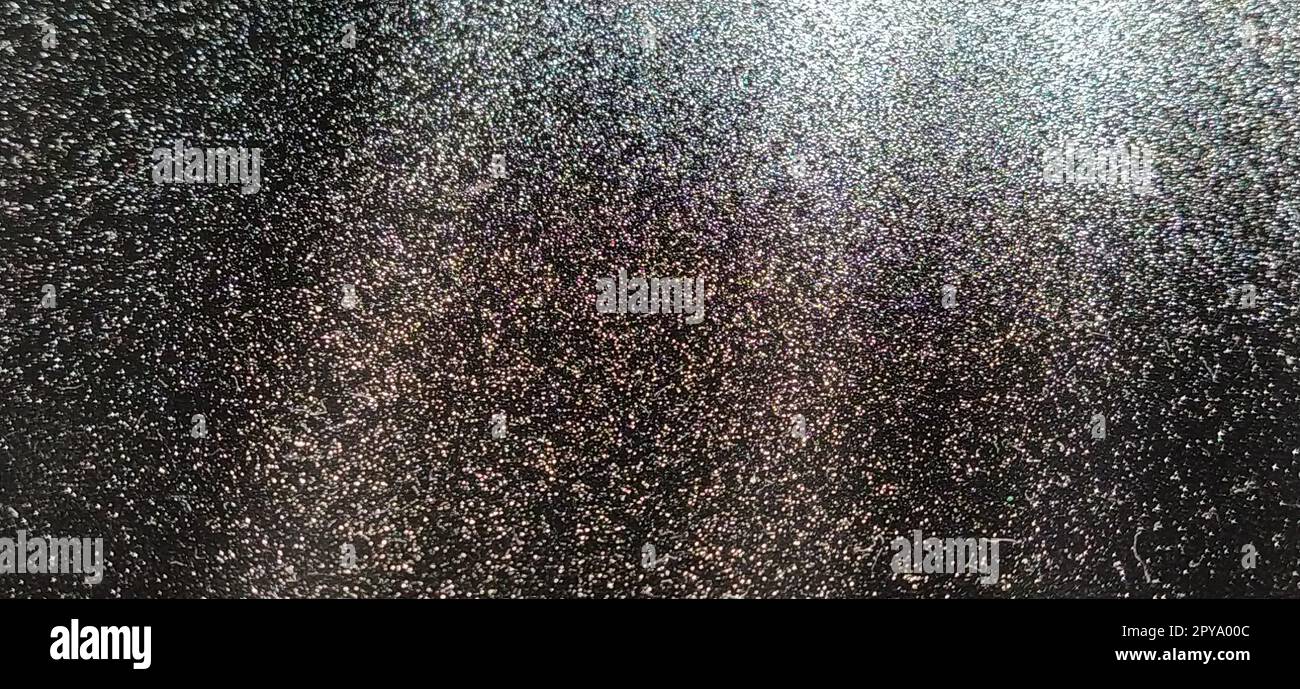 Light beam on black background with sparkles, radiance and sparkles. Festive background. Divine or moonlight effect. Rays falling from top to bottom. The spotlight is shining Stock Photo