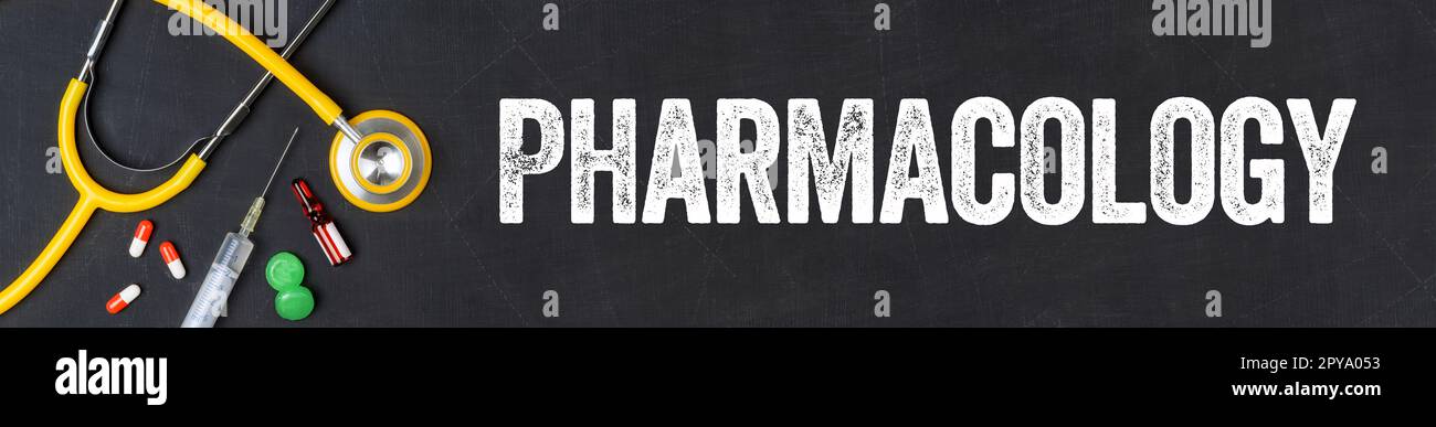 Stethoscope and pharmaceuticals on a blackboard - Pharmacology Stock Photo