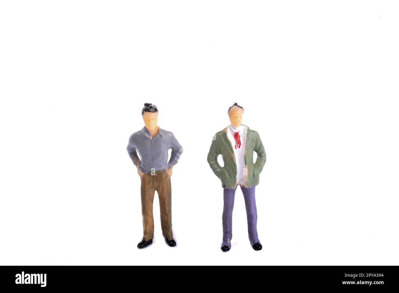 Two figurine model men standing side by side Stock Photo