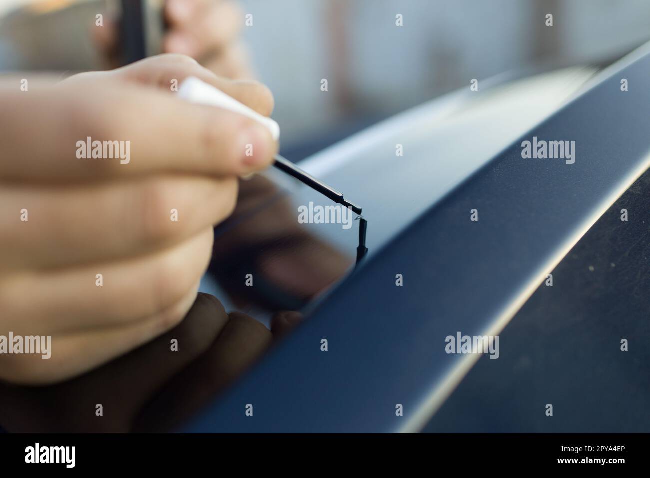 Brush painting small scratches chip car vehicle detailing paint Stock