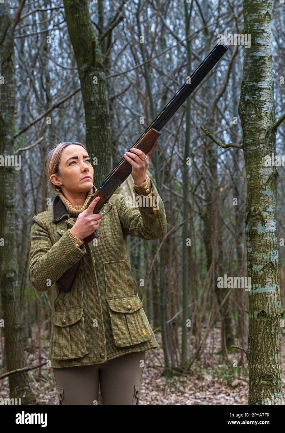 A thirty plus year old woman shooting in woodlands at last light in the