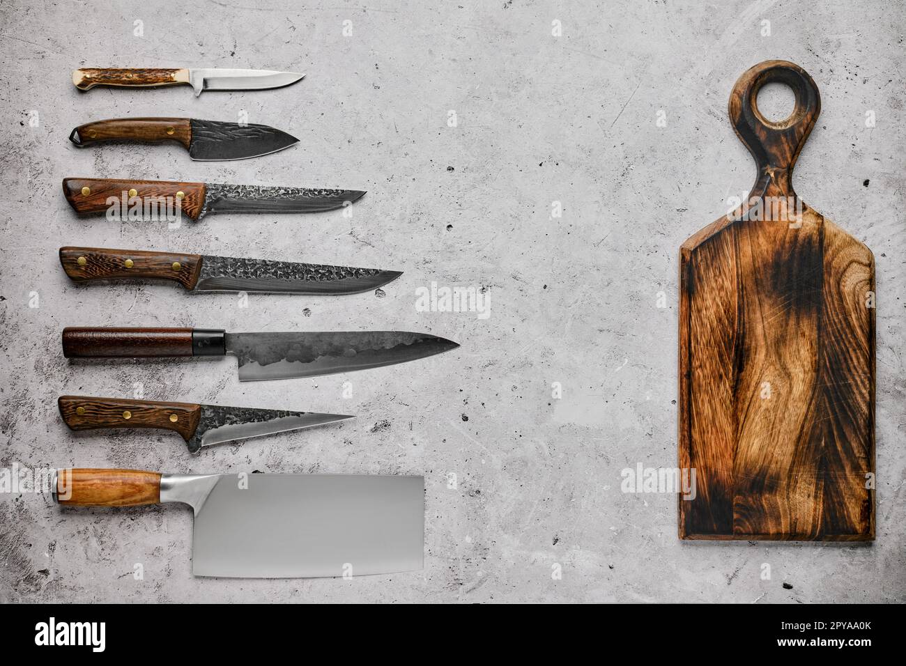 https://c8.alamy.com/comp/2PYAA0K/different-kinds-of-knives-and-cutting-board-2PYAA0K.jpg
