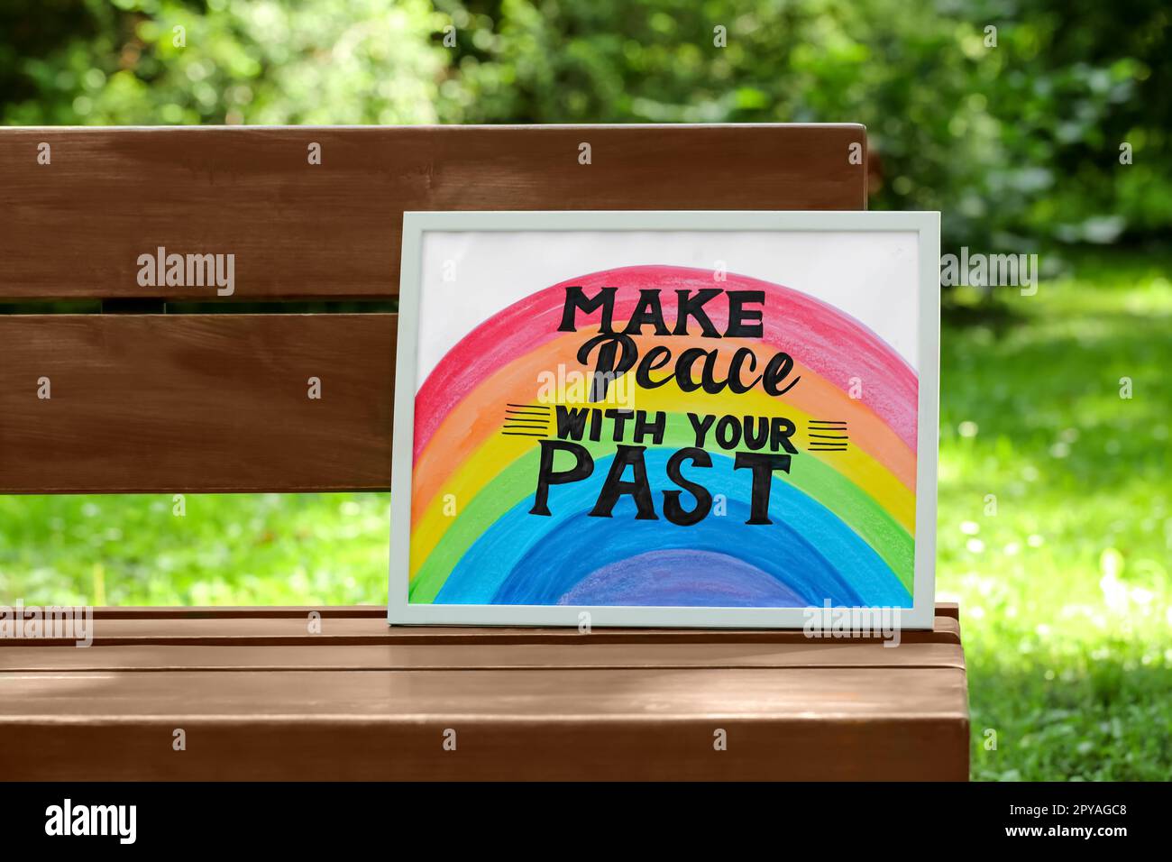 Phrase Make Peace With Your Past written on poster outdoors Stock Photo
