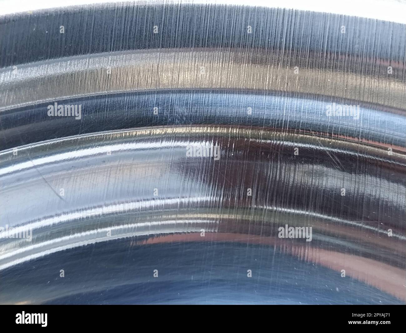 metal curved surface. A close-up of an aluminum or chrome surface. Gradient of light and color Stock Photo