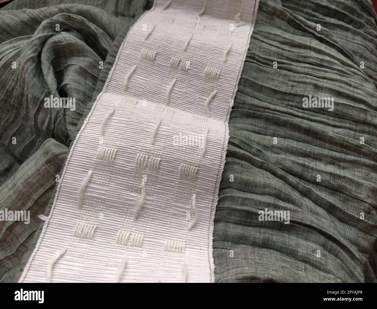 Rear view of bedroom curtain showing blackout lining and gathering tape  Stock Photo - Alamy