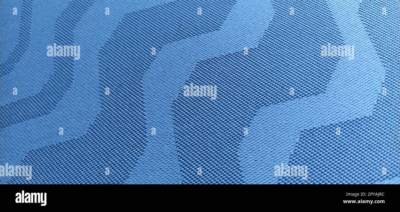 abstract blue curves on a gray background. Fabric texture. Wide lines and winding stripes Stock Photo