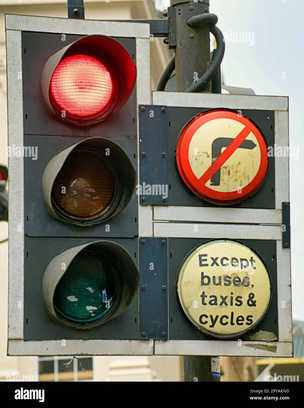 traffic lights at red no right turn except for taxis and cycles Stock Photo