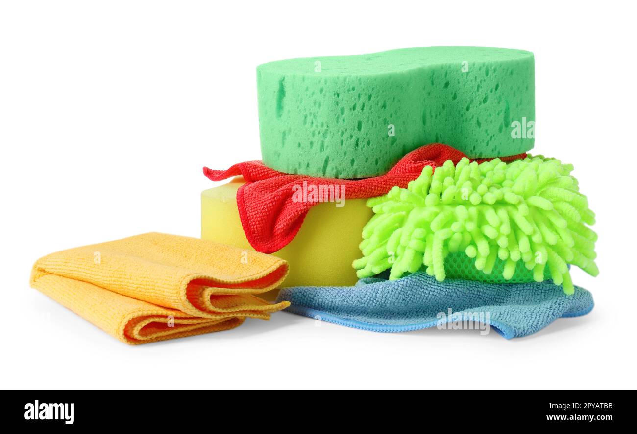 Sponges, cloths and car wash mitt on white background Stock Photo Alamy