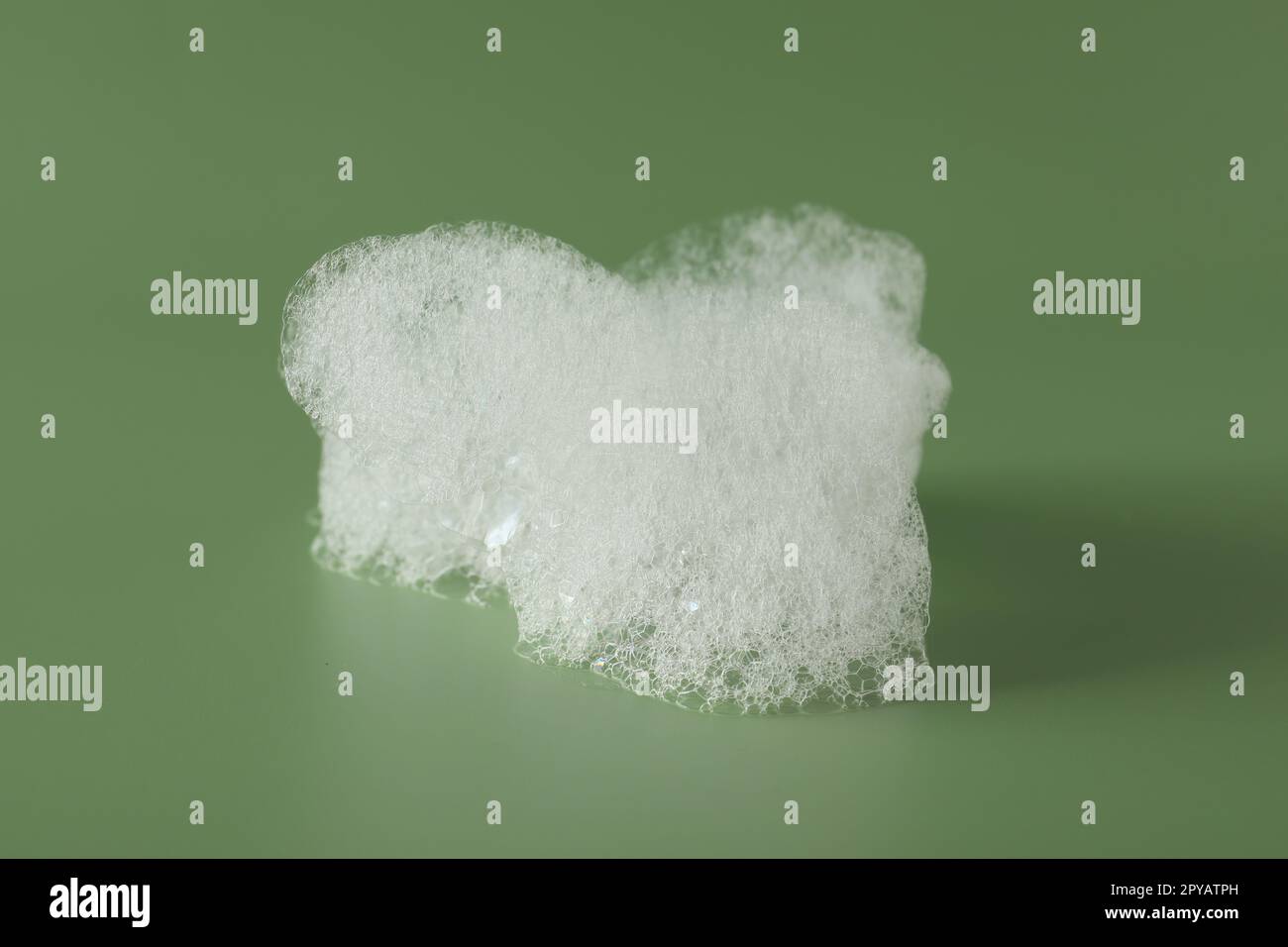 https://c8.alamy.com/comp/2PYATPH/drop-of-fluffy-bath-foam-on-olive-background-2PYATPH.jpg