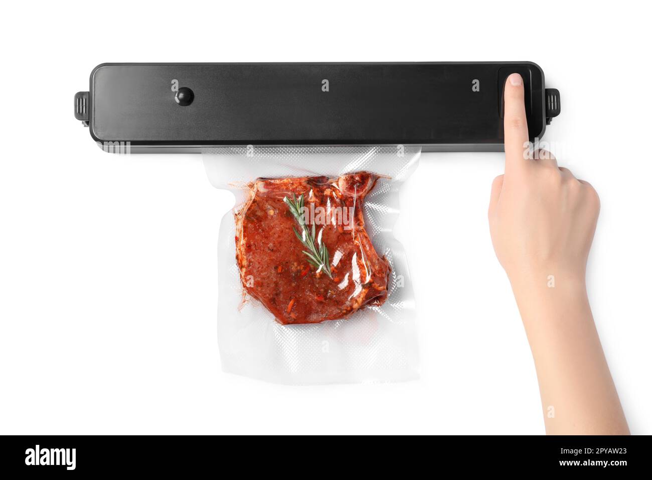 Woman using sealer for vacuum packing and plastic bag with meat steak