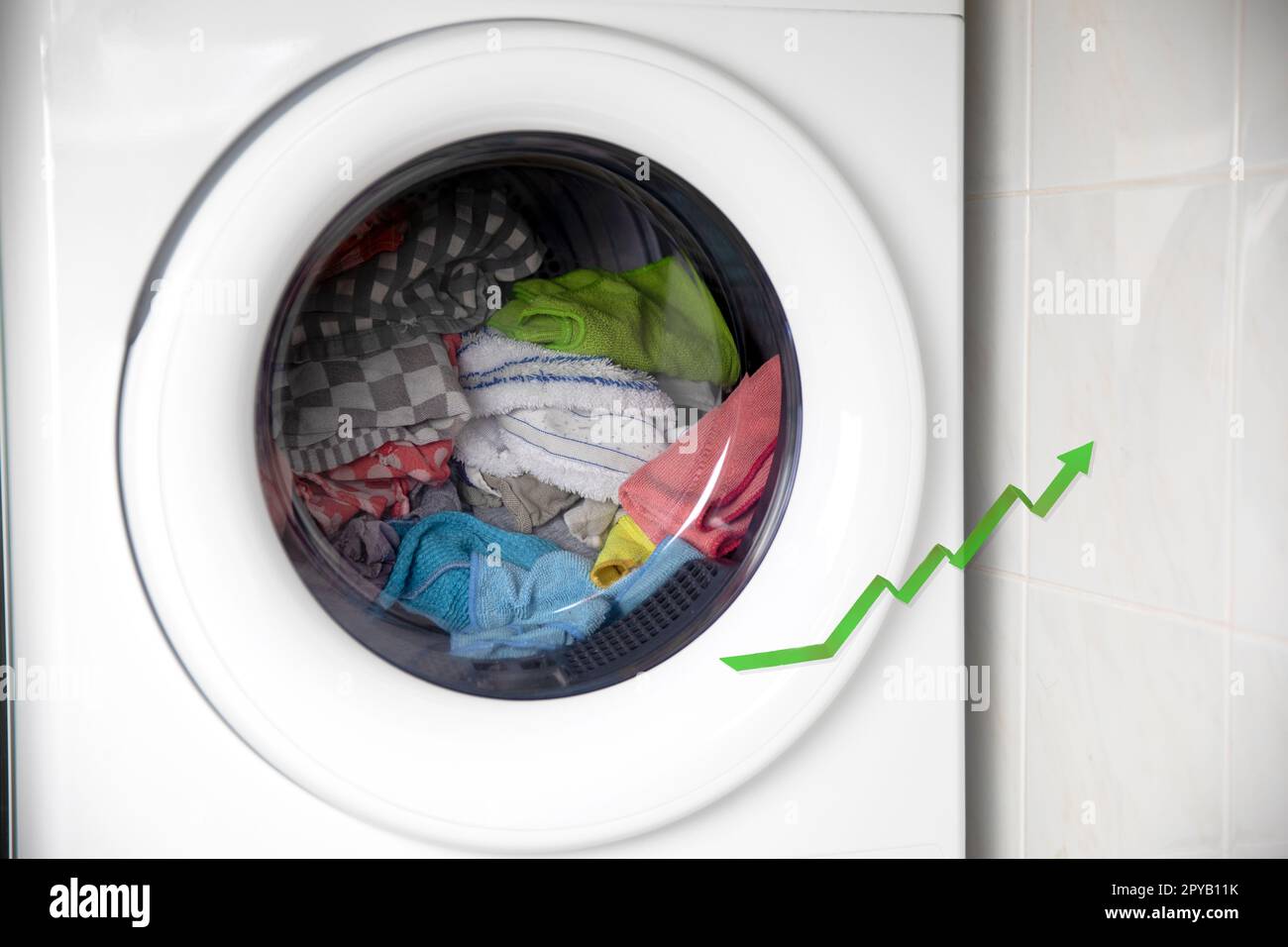 Concept of saving electricity with a washing machine white electrical